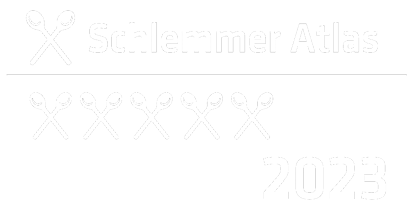 Logo des Schlemmer-Atlas 2023, Erwähnung des Söl’ring Hof Sylt als Urlaubsziel.