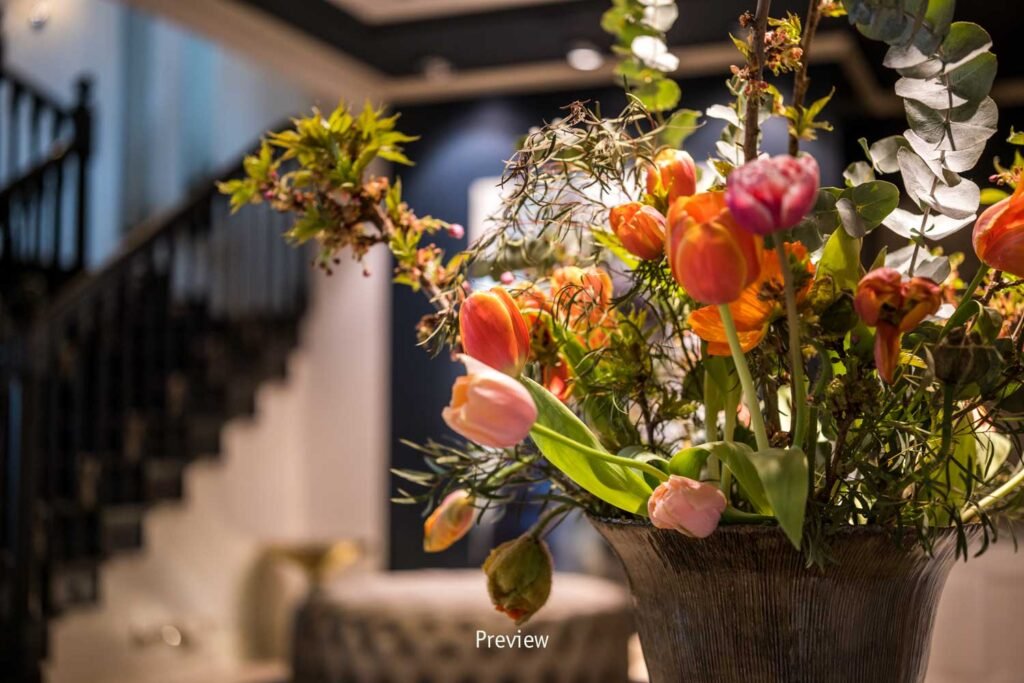 Tulips in vase, modern room—Söl’ring Hof, Sylt holiday.